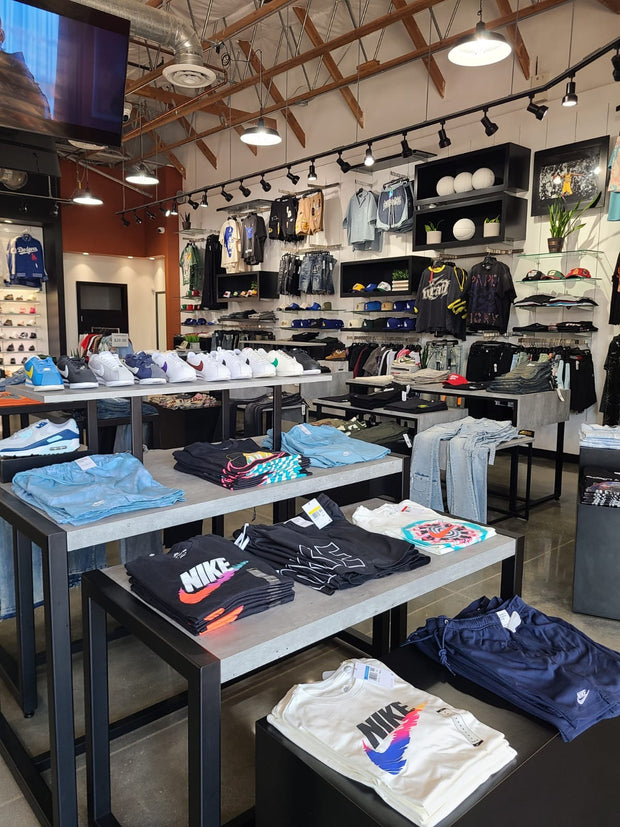 Modern sneaker and streetwear store interior with apparel displays
