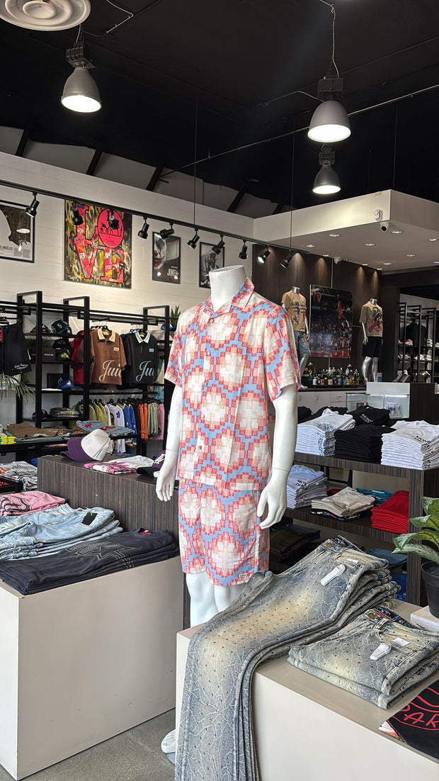 Mannequin wearing patterned short-sleeve dress in trendy streetwear store interior