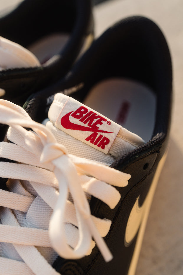 Vintage Nike Bike Air tongue label close-up on black sneaker — denim exchange