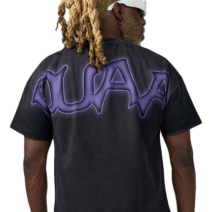 Back view of a black cotton Duaa Creature T-shirt featuring a large, stylized purple graphic across the upper back.