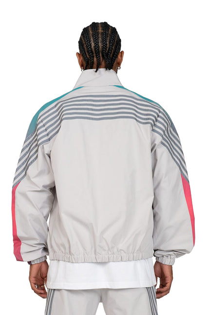 EPTM Proxy jacket in light grey featuring teal shoulder panels, pink sleeve stripes, and grey ribbed fabric details.