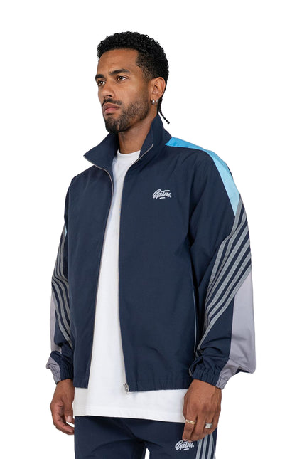 EPTM Proxy track jacket in navy blue featuring light blue and grey color-blocked sleeves with dark striped detailing.