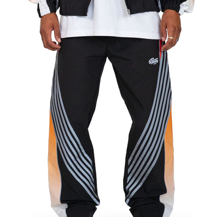 EPTM Proxy track pants in black with prominent silver reflective arched stripes and orange gradient side panel detailing.