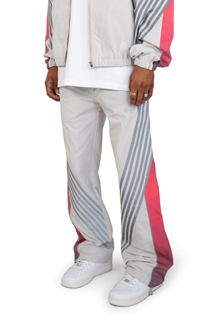 EPTM Proxy pants in grey feature a lightweight nylon finish with diagonal grey stripes and bold pink side panels.