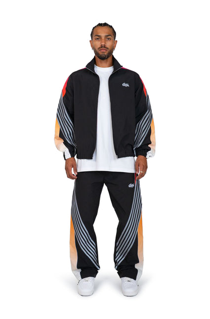 EPTM Proxy jacket and matching track pants in black featuring a vibrant red and orange gradient stripe detail.