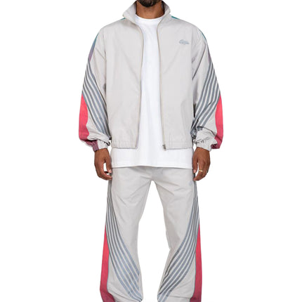 EPTM Proxy track set featuring a grey zip-up windbreaker and matching pants with teal and hot pink gradient accents.