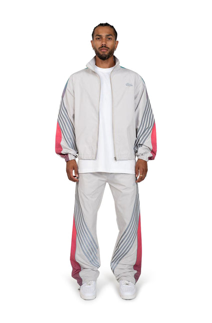 EPTM Proxy track set featuring a grey zip-up windbreaker and matching pants with teal and hot pink gradient accents.