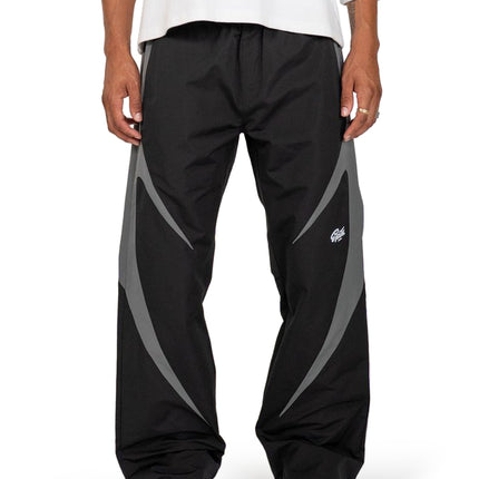 EPTM Blade pants in black featuring a smooth nylon finish with contrasting grey curved side panels and a tapered fit.