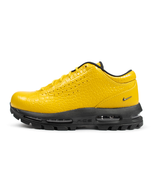 Nike Air Max Goadome Low sneaker in vivid sulfur yellow with crocodile-embossed leather, black laces and rugged sole.