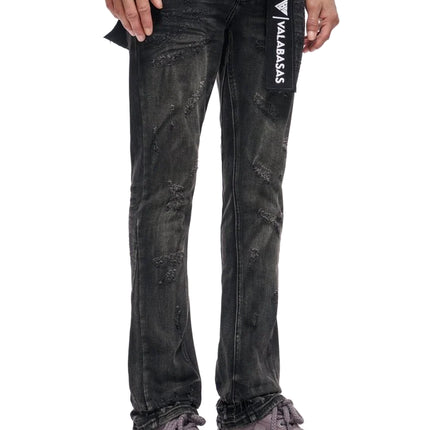 Valabasas Wired black wash denim jeans featuring a distressed texture, slim fit, and a branded rectangular hang tag.