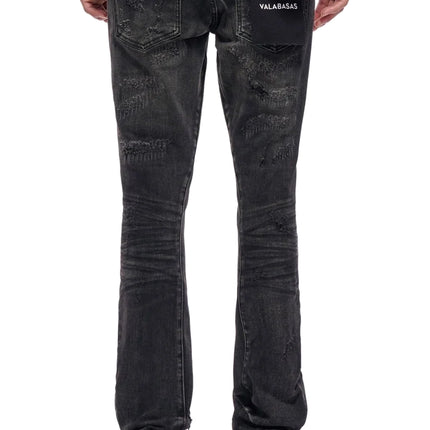 Back view of Valabasas Wired black wash denim jeans featuring distressed details and a branded patch on the pocket.