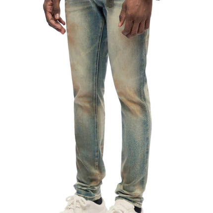 Trnchs Monarch skinny fit jeans in a distressed dark blue wash with faded light brown highlights and denim texture.