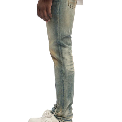 Trnchs Monarch skinny fit jeans in a vintage-washed dark blue denim featuring a slim silhouette and distressed finish.