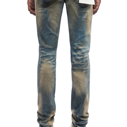 Trnchs Monarch skinny fit jeans in a dark blue dirty wash with distressed whiskering details on the back view.
