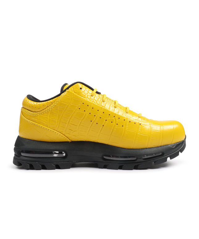 Nike Air Max Goadome Low sneaker in vivid sulfur yellow crocodile-embossed leather with a rugged black lugged sole.