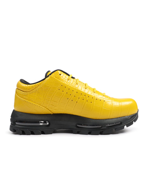 Nike Air Max Goadome Low sneaker in vivid sulfur yellow crocodile-embossed leather with a rugged black lugged sole.