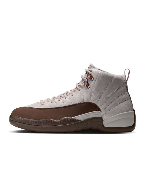 Air Jordan 12 Retro in light orewood brown and cacao wow featuring pebbled leather, suede overlays, and metallic eyelets.