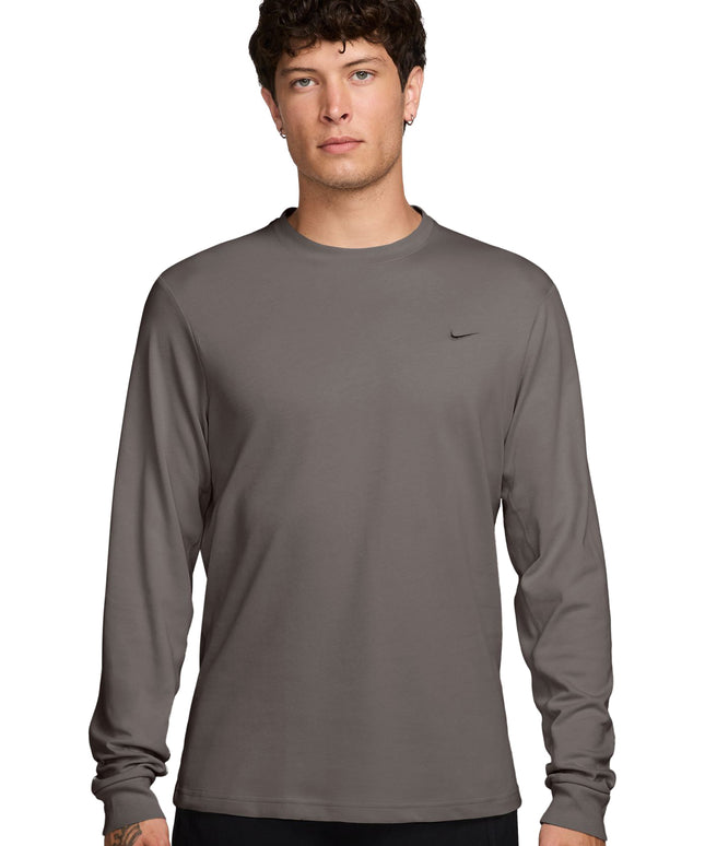 Nike Mens Primary long-sleeve athletic top in cave stone gray featuring a small black swoosh logo on the left chest.