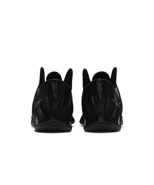 Back view of black Nike G.T. Future basketball sneakers featuring a glossy, molded shell finish on a white background.