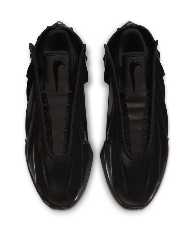 Top-down view of Nike G.T. Future sneakers in sleek triple black, featuring a glossy synthetic finish and central swoosh.