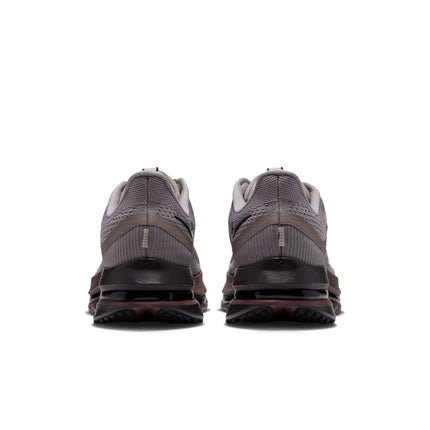 Back view of Nike Pegasus Premium sneakers in college grey mesh with dark brown midsole and black heel detailing.
