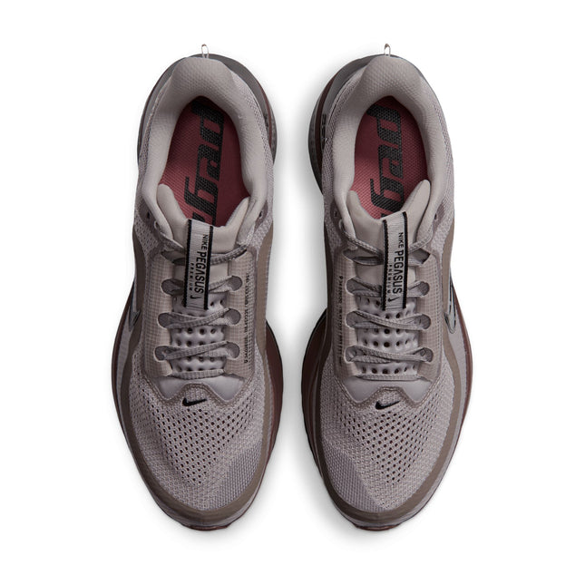 Top view of Nike Pegasus Premium sneakers in college grey mesh, black details, and light redwood accents on white.