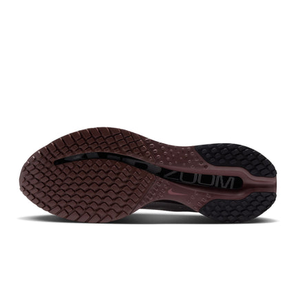 Bottom view of a Nike Pegasus Premium sneaker featuring a dark burgundy rubber outsole with a textured grip pattern.