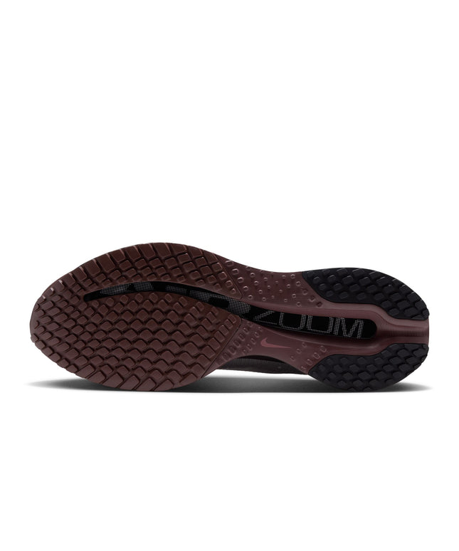 Bottom view of a Nike Pegasus Premium sneaker featuring a dark burgundy rubber outsole with a textured grip pattern.