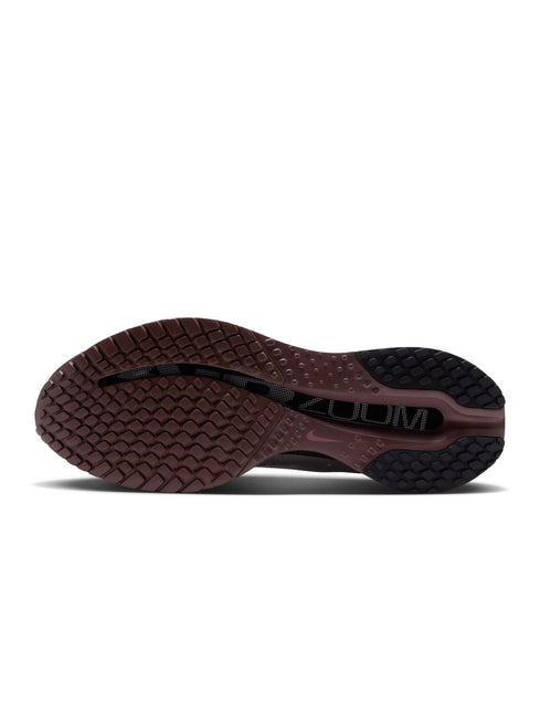 Bottom view of a Nike Pegasus Premium sneaker featuring a dark burgundy rubber outsole with a textured grip pattern.