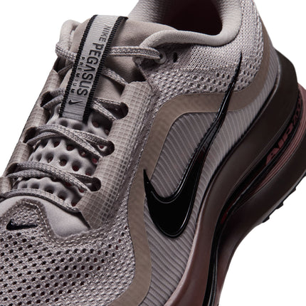 Close-up of Nike Pegasus Premium sneaker in college grey mesh with a glossy black Swoosh and redwood midsole.
