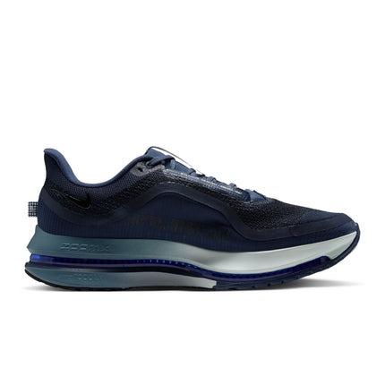 Nike Pegasus Premium men's sneaker in smokey blue mesh, featuring a sleek dual-tone foam sole and dark navy accents.