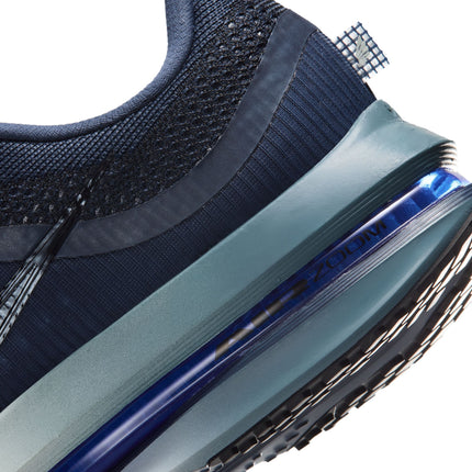 Close-up view of the heel of a smoky blue Nike Pegasus Premium sneaker, highlighting the metallic blue Zoom air unit.