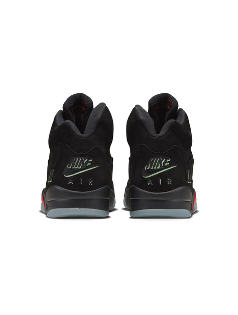 Back view of black suede Air Jordan 5 Retro sneakers featuring neon green Nike Air embroidery on the heel.