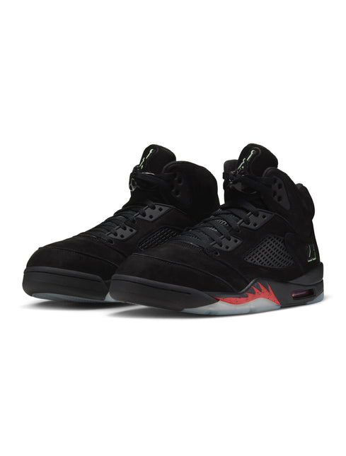 Air Jordan 5 Retro sneakers in black suede featuring a bright green Jumpman logo and speckled red flame midsole details.