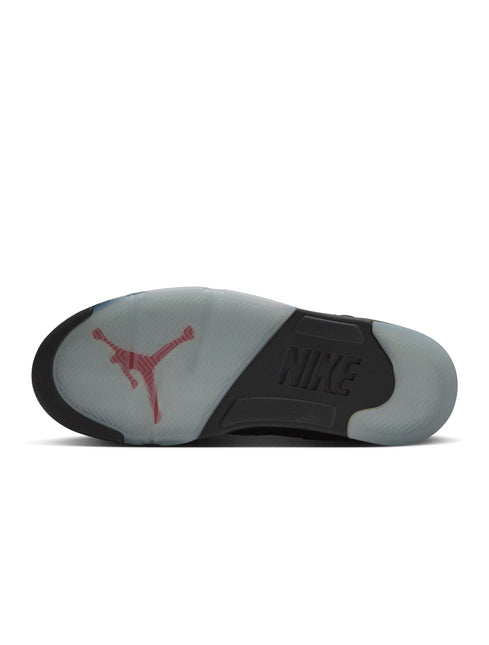 Bottom view of Air Jordan 5 Retro sneaker with a translucent icy blue outsole, red Jumpman logo, and black Nike text.