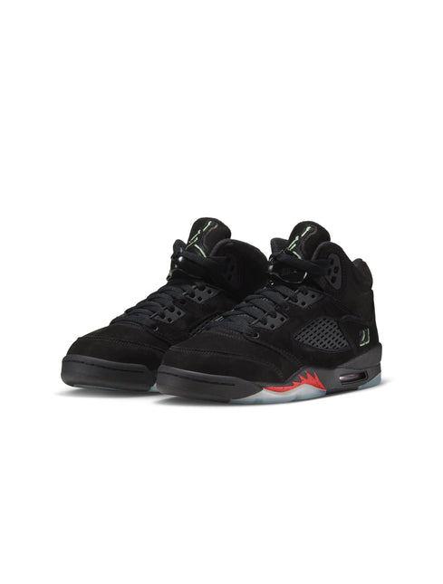 Pair of black suede Air Jordan 5 sneakers with red midsole accents shown from the front and side.