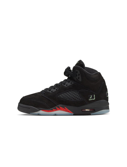 Side view of a black suede Air Jordan 5 sneaker with red accents on the midsole and a translucent icy outsole.