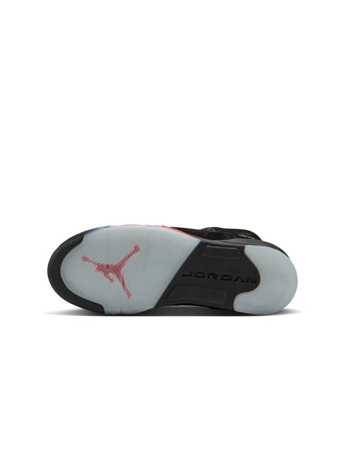 Bottom view of a black Air Jordan 5 sneaker showing the translucent icy outsole with a red Jumpman logo.
