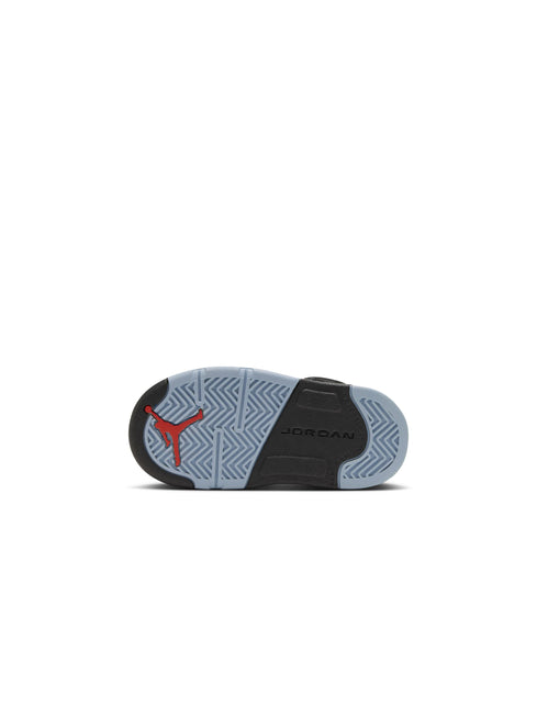 Bottom view of an Air Jordan 5 Retro toddler shoe featuring light blue rubber outsoles with a red Jumpman logo.