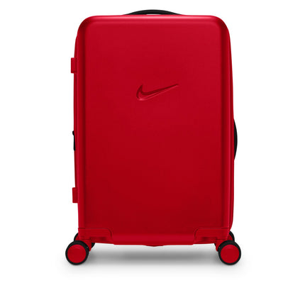 Nike unisex carry-on luggage in university red featuring a sleek hardshell finish and a molded black Nike swoosh logo.