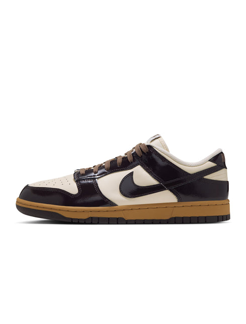 Nike Dunk Low Retro in shadow brown patent leather overlays with coconut milk panels and a sturdy gum rubber outsole.