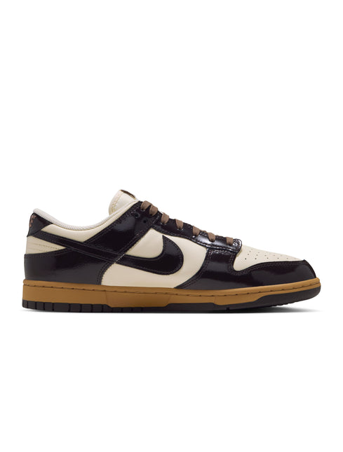 Nike Dunk Low Retro in shadow brown patent leather overlays, coconut milk base, and a gum brown rubber outsole.