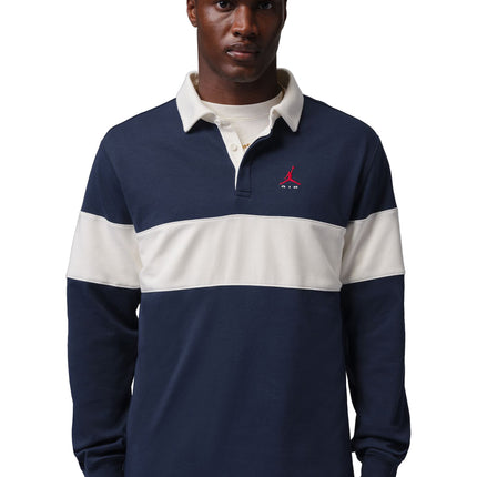Nike Jordan Brooklyn long-sleeve rugby shirt in navy blue and sail with a red Jumpman logo and contrast collar.