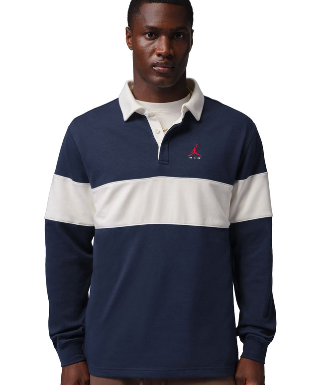 Nike Jordan Brooklyn long-sleeve rugby shirt in navy blue and sail with a red Jumpman logo and contrast collar.