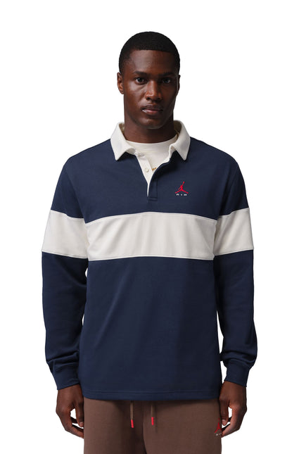 Nike Jordan Brooklyn long-sleeve rugby shirt in navy blue and sail with a red Jumpman logo and contrast collar.