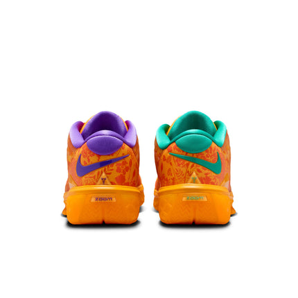 Rear view of Nike Kobe Protro 3 sneakers in safety orange with floral patterns, purple accents, and teal heel collars.