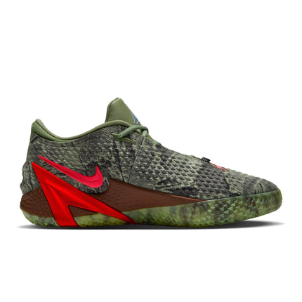 Nike Ja 4 Halloween sneaker in oil green with snake-patterned mesh, bright red Swoosh, and a textured brown midsole.