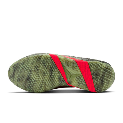 Bottom view of Nike Ja 4 Halloween sneaker featuring a textured oil green camo tread and bright red neon midfoot shank.