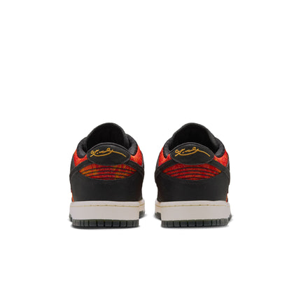 Rear view of Nike Dunk Low Protro sneakers in anthracite black suede with a vibrant red and orange textured heel tab.