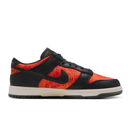 Nike Dunk Low sneaker in black leather with vibrant orange patterned textile panels and a cream-colored rubber sole.